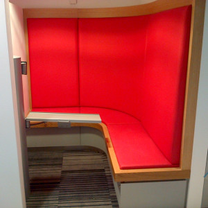 Cubicle with red sofa