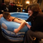 Jo Ind in a birthing pool with an antenatal teacher stroking her back. For Jo Ind's blog: What is a writer?
