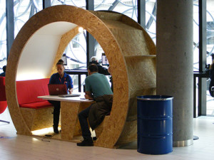 Woman giving a man a consultation in a pod at Google's Digital Garage